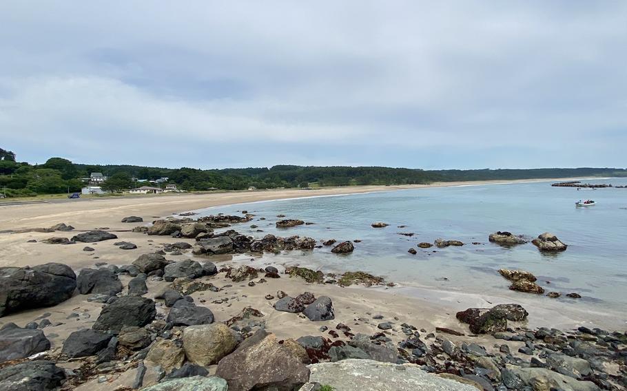 Some rocks can be seen on the beach.