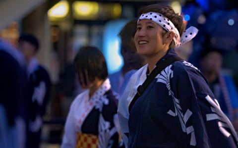 Photo Of U.S. Air Force Capt. Rachel Curtis, 459th Airlift Squadron C-12 Huron pilot, performs a traditional Niigata dance during the Niigata festival, Aug. 8, 2025.