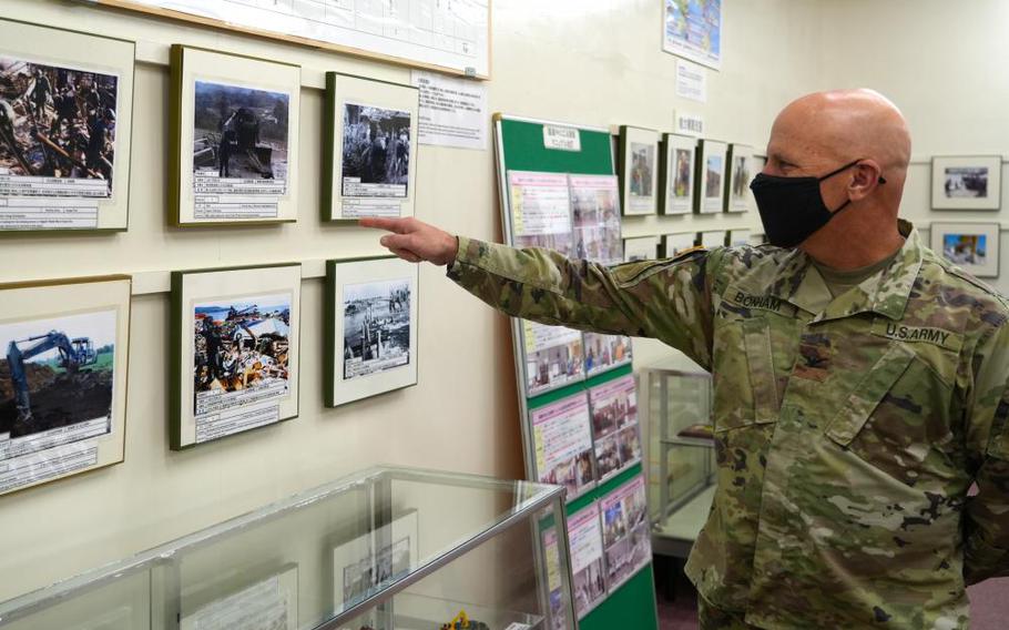 U.S. Army Corps of Engineers – Japan Engineer District (USACE JED) commander, Col. Gary Bonham, reacts to an image within a Japanese Ground Self Defense Force engineer school museum, during a visit to Camp Katsuta, in Ibaraki prefecture, Japan, Nov. 21, 2022. Bonham was able to tour the facility, which included replicas of construction vehicles, models of JGSDF-built locations, and photos and memorabilia from past armed conflicts. (Photo by Patrick Ciccarone)