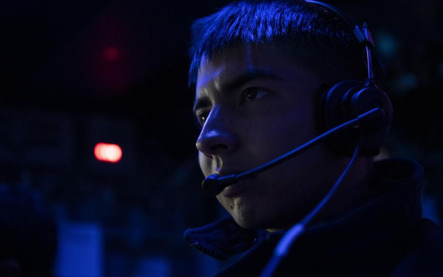 Fire Controlman 2nd Class Christian Contreras, from Farmersville, California, stands watch in the Combat Information Center aboard the Arleigh Burke-class guided-missile destroyer USS Dewey (DDG 105) while participating in Surface Warfare Advanced Tactical Training (SWATT). SWATT provides the Fleet opportunities to complete the tactical exercise required for increased lethality and tactical proficiency. (U.S. Navy photo by Mass Communication Specialist 1st Class Benjamin Lewis)