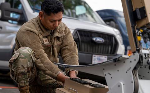 Photo Of U.S. Air Force Staff Sgt. Justin Bartolome, 374th Logistics Readiness Squadron fuels environment safety office NCOIC, sets up the modem for the Hawkeye III Lite during the Communications Fly-Away Kit 101 course at Yokota Air Base.