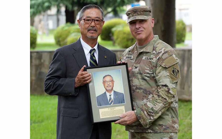 Former U.S. Army Corps of Engineers - Japan Engineer District (USACE JED) Electrical Engineer, Katsuji Suzuki, poses alongside JED Commander, Col. Gary Bonham, with his newly awarded photo to be hung in the ‘Gallery of Distinguished Civilians,’ on Camp Zama, Japan, July 11th, 2024.