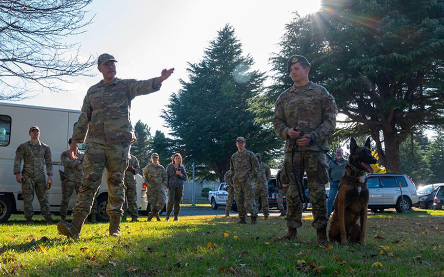 U.S. Air Force Staff Sgt. Micheal Dacoron and Airman 1st Class Samuel Mcpheron, 35th Security Forces Squadron military working dog (MWD) handlers, perform a MWD Demonstration for Aomori Prefecture Police cadets at Misawa Air Base, Japan, Nov. 9, 2023. MWDs are highly trained dogs that work alongside security forces. (U.S. Air Force photo by Airman 1st Class Koby Mitchell)