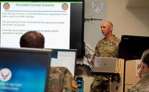 Photo Of U.S. Air Force Master Sgt. David Miller, 373rd Training Squadron Detachment 15 operations flight chief, talks about a simulated combat scenario for an Aircraft Battle Damage Repair course at Yokota Air Base, Japan, March 18. 