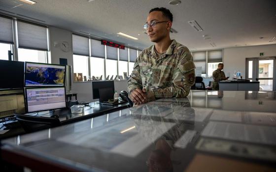 U.S. Air Force Staff Sgt. Elijah Tait, 35th Operations Support Squadron (OSS) weather operations and planning noncommissioned officer in charge, delegates mission duties for the day to weather forecasters at Misawa Air Base.