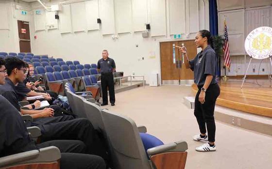 Photo Of Kayesha McNeill, right, a 2020 graduate of Zama Middle High School and former member of the school’s Junior Reserve Officer Training Corps, speaks to cadets Sept. at the school about her experiences as a newly commissioned U.S. Army officer.