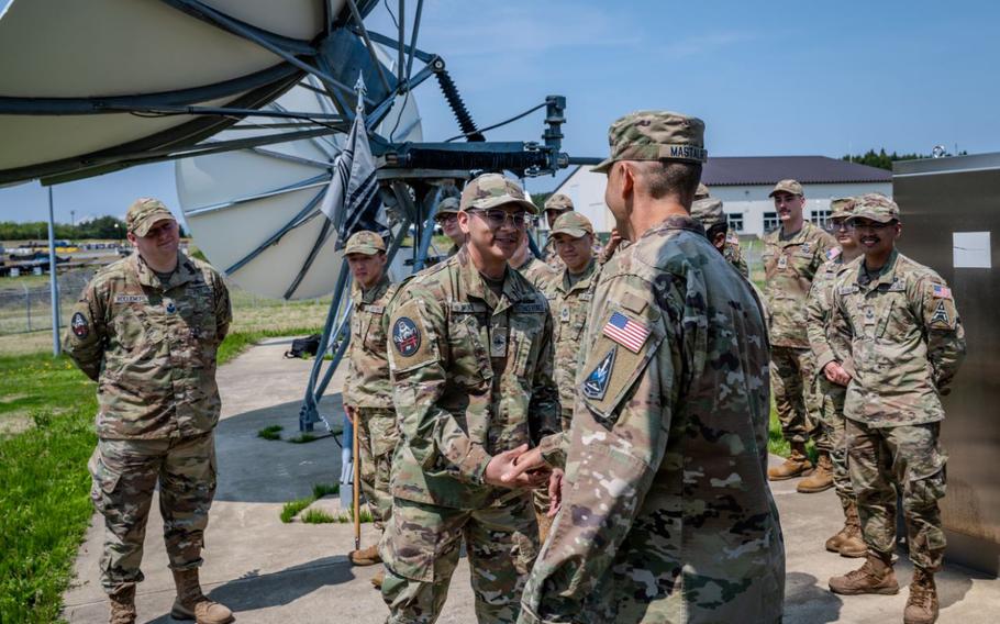 U.S. Space Force Brig. Gen. Anthony Mastalir, U.S. Space Forces Indo-Pacific commander, right, shakes hands with a Guardian assigned to the 5th Space Warning Squadron Detachment 4 during a visit to Misawa Air Base, Japan.