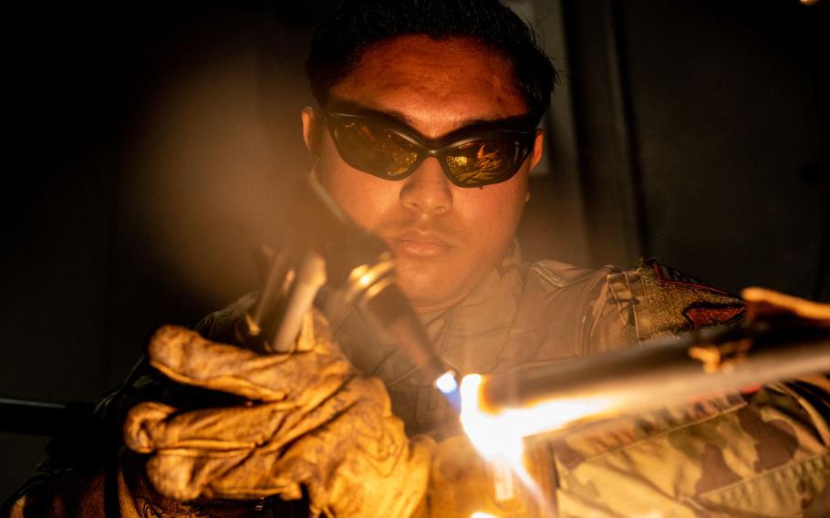 U.S. Air Force Senior Airman William Andres, 35th Maintenance Squadron metals technology journeyman, cuts a metal bar with a welding machine at Misawa Air Base, Japan, May 28, 2024.