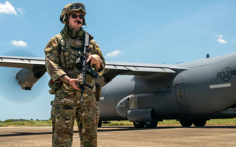 U.S. Air Force Senior Airman Josiah Markum, 374th Security Forces Squadron fly-away security team member, secures the perimeter around a C-130J Super Hercules assigned to the 36th Airlift Squadron after unloading assets in support of U.S. Army Pacific operations in the Philippines.