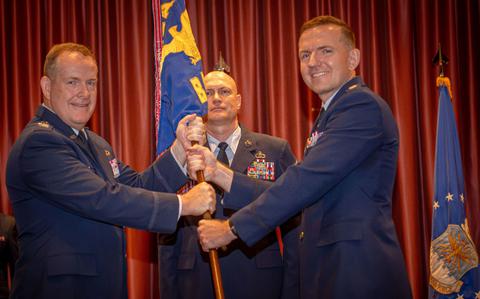 Photo Of From the left, U.S. Air Force Col. Sean McKenna, Pacific Air Forces public affairs director, presents the guidon to incoming commander, Lt. Col. Joseph Hansen during a change of command ceremony at Yokota Air Base, Japan, June 14, 2024.