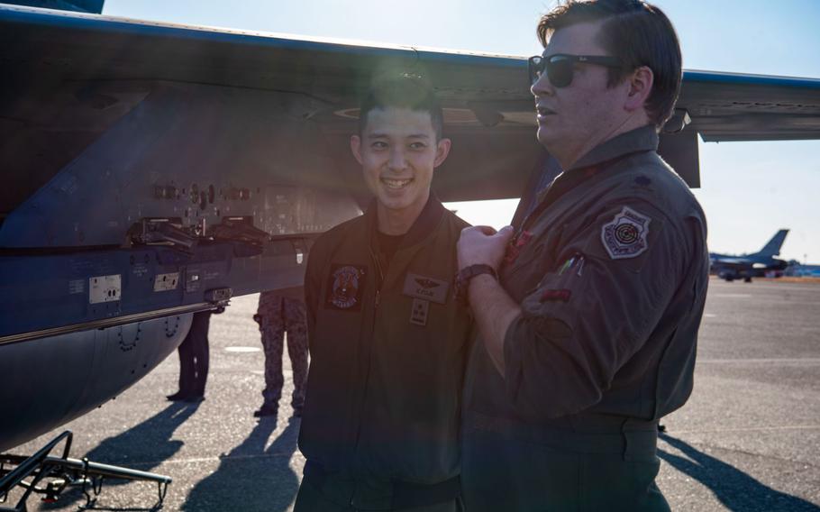 U.S. Air Force Lt. Col. Keegan Dale, 13th Fighter Squadron commander, speaks with a Japan Air-Self Defense Force F-2 pilot during the Aviation Training Relocation exercise at Hyakuri Air Base, Japan, Jan. 30, 2024. The ATR program in Japan is designed to enhance operational readiness and bilateral interoperability between the U.S. Air Force and the Japan Air Self-Defense Force while mitigating the noise impact of military flights on local communities around crowded bases.