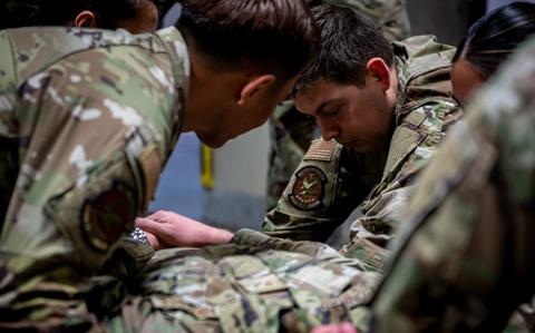Photo Of U.S. Air Force Airman 1st Class Remington Shafer, right, 35th Dental Squadron dental assistant, supports a stretcher transfer during a home station medical response training at Misawa Air Base, Japan, May 8, 2025.