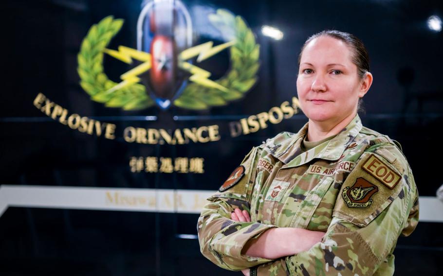 U.S. Air Force Senior Master Sgt. Diana Rogers, 35th Civil Engineer Squadron, Explosive Ordnance Disposal (EOD) superintendent, poses in front of a utility vehicle at Misawa Air Base, Japan, March 31, 2023. Rogers was selected for promotion to chief master sergeant, becoming the first female E-9 in the EOD career field in over 30 years. (U.S. Air Force photo by Staff Sgt. Kristen Heller)