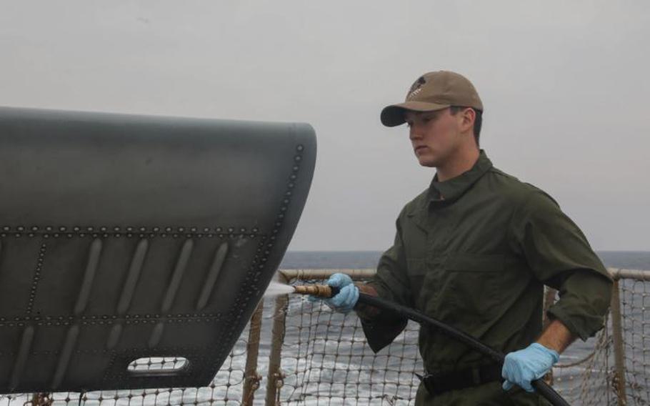 Aviation Structural Mechanic Airman Jacob Walt McQuillan, from Brownsburg, Indiana, cleans a Seahawk helicopter (MH-60R) aboard the Arleigh Burke-class guided-missile destroyer USS Rafael Peralta (DDG 115) in the Sea of Japan, Nov. 16. Rafael Peralta is forward-deployed and assigned to Commander, Task Force 71/Destroyer Squadron (DESRON) 15, the Navy’s largest DESRON and the U.S. 7th Fleet’s principal surface force. (U.S. Navy photo by Mass Communication Specialist 3rd Class Alexandria Esteban)