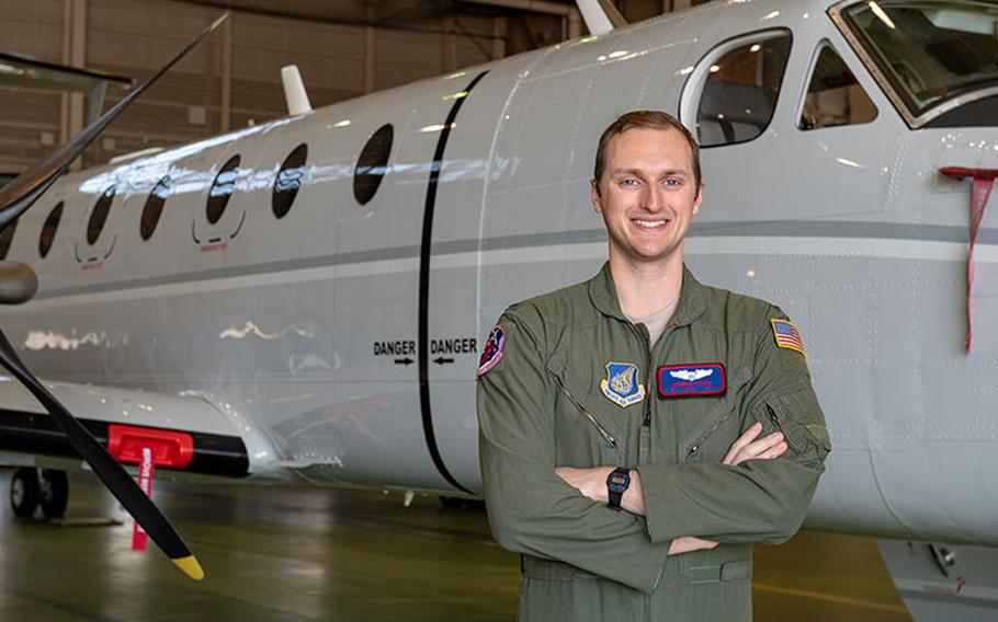 A C-12J Huron pilot with the 459th Airlift Squadron, 1st Lt. Danial Carr, poses for a photo, April 6, 2020, at Yokota Air Base, Japan. The C-12J pilots are responsible for aeromedical evacuation for all military personnel and their families in Southeast Asia. (U.S. Air Force photo by Airman 1st Class Brieana E. Bolfing)