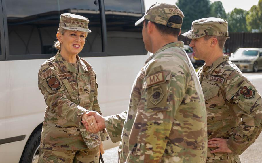 U.S. Air Force Lt. Gen. Laura Lenderman shakes hands with Lt. Col. Eric Cranford.