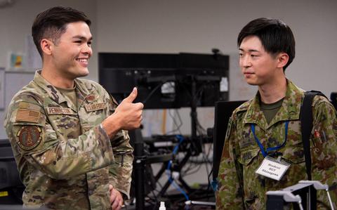 Photo Of U.S. Air Force Senior Airman Tanner Pennington, left, 35th Communications Squadron cyber transport technician, gives a thumbs up to Japan Ground Self-Defense Force Sgt. Daimu Shinagawa, Basic English Training course student, during a JGSDF Basic English Training Course tour at Misawa Air Base, Japan, July 18, 2024.