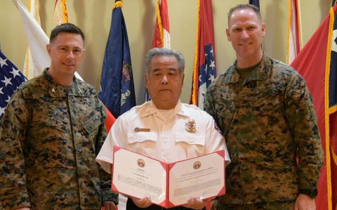 Photo Of A few members of Combined Arms Training Center, Camp Fuji gathered to give Takanobu Tsuchiya, a firefighter, proper closure to his 39-year career at the installation, December 13, 2024.