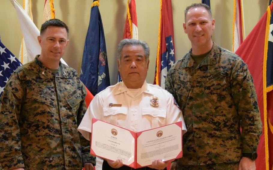 A few members of Combined Arms Training Center, Camp Fuji gathered to give Takanobu Tsuchiya, a firefighter, proper closure to his 39-year career at the installation, December 13, 2024.