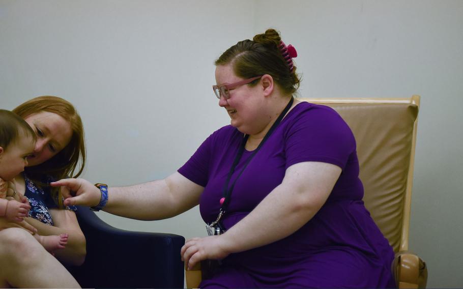 Mandy Wagnild, 35th Surgical Operations Squadron lactation specialist, interacts with a mother and child during a support session at Misawa Air Base, Japan, Aug. 5, 2024.