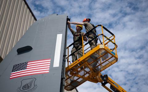 Photo Of From left, U.S. Air Force Staff Sgt. Robert Looper, 374th Maintenance Group aero repair specialist, and Senior Airman Memphis Thompson, 374th MXG aircraft structures mechanic, inspect a C-130J Super Hercules before repairs at Yokota Air Base, Japan.