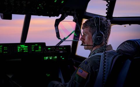 Photo Of U.S. Air Force Lt. Col. Matthew Hamblen, Kentucky Air National Guard 165th Airlift Squadron pilot, flies a C-130J Super Hercules back to Yokota Air Base, Japan.
