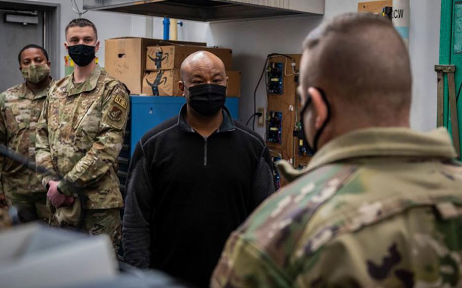 U.S. Air Force Col. Jesse J. Friedel, 35th Fighter Wing commander, presents the Civilian Category II of the Fourth Quarter award to Mr. Michael McGlothan, assigned to the 35th Civil Engineering Squadron, at Misawa Air Base, Japan, Feb. 4, 2022. The awards are presented quarterly to recognize members at Misawa AB who display hard work and dedication to the installation and mission. (U.S. Air Force photo by Airman 1st Class Leon Redfern)