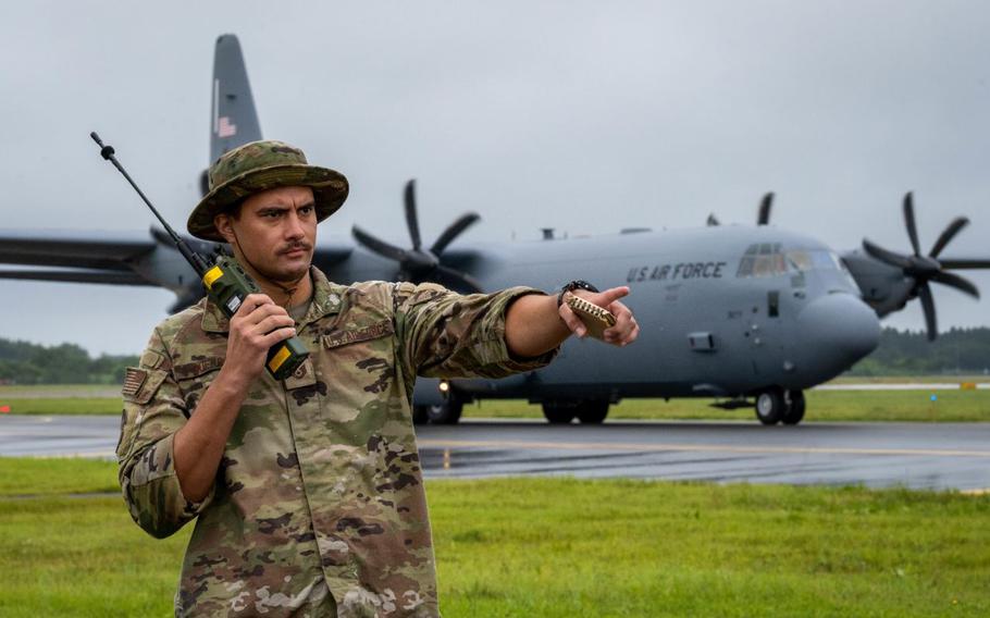 U.S. Air Force Tech. Sgt. Nelson Guerra, 36th Operations Support Squadron Landing Zone Safety Officer (LZSO) course participant, communicates with a C-130 Hercules over radio during the first ever LZSO course at Misawa Air Base, Japan, July 26, 2024.