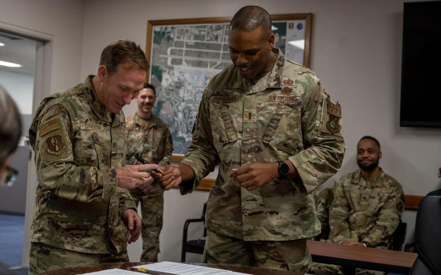 U.S. Air Force Col. Paul Davidson, left, 35th Fighter Wing Commander, and U.S. Air Force 2nd Lt. Kade Forrester, 35th Contracting Squadron acquisition flight commander, finalize a purchase during the end of fiscal year closeout at Misawa Air Base, Japan, Sept. 30, 2024. 