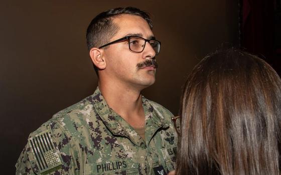 Photo Of Logistics Specialist 1st Class Haeden Phillips, assigned to Naval Air Facility (NAF) Atsugi, is promoted to his current rate during a frocking ceremony held at Cinema 77 onboard NAF Atsugi.