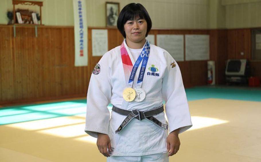 Japan Ground Self-Defense Force Capt. Shori Hamada poses with the individual gold medal and mixed-team silver medal she won in judo at the 2020 Olympics. This photo was taken at the Japan Self-Defense Force’s Physical Training School at Camp Asaka in Tokyo, Nov. 29, 2021. (Photo Credit: Noriko Kudo)