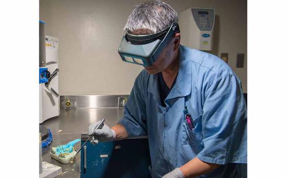 Photo Of Fujio Ishikawa, 374th Dental Squadron dental laboratory technician, prepares a dental cast at Yokota Air Base, Japan, Aug. 7, 2024.