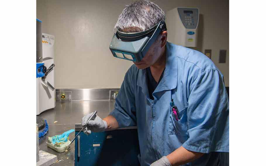 Fujio Ishikawa, 374th Dental Squadron dental laboratory technician, prepares a dental cast at Yokota Air Base, Japan, Aug. 7, 2024.