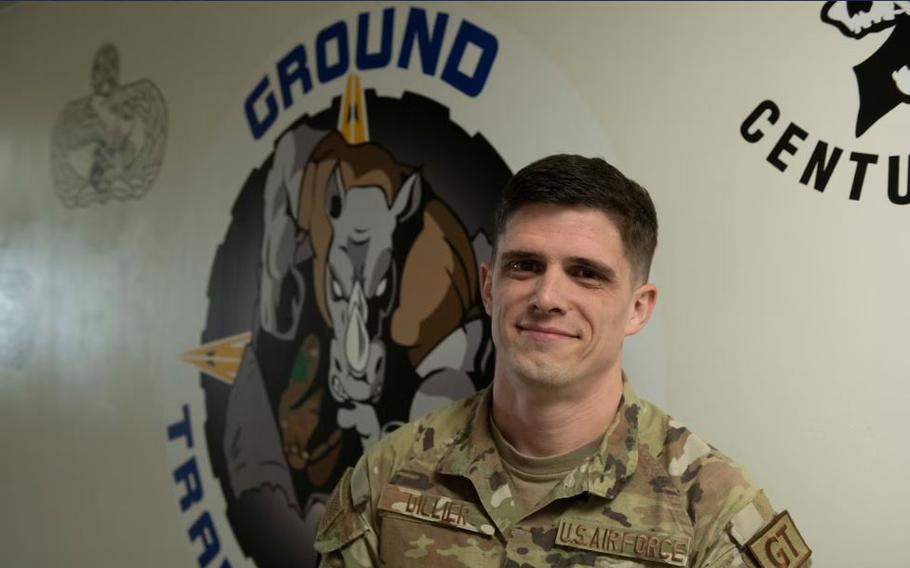 Tech. Sgt. Anthony Dillier, 35th Logistics Readiness Squadron ground transportation noncommissioned officer in charge, poses in front of a ground transportation logo at Misawa Air Base, Japan, Feb. 20, 2024. Dillier was awarded the Lance P. Sijan Leadership Award at the Pacific Air Forces level for his leadership ability and efforts in increasing mission efficiency.