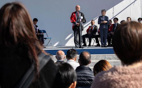 Photo Of Yasuhiro Yamazaki, Musashimurayama City mayor, gives opening remarks during the Dehdara Festival in Musashimurayama City, Japan, Nov. 9, 2024.