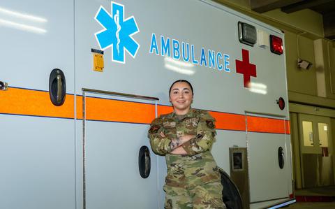 Photo Of Wild Weasel of the Week (WWoW), U.S. Air Force Senior Airman Alexis Syler, 35th Healthcare Operations Squadron emergency services technician, poses in front of an ambulance at her work center.