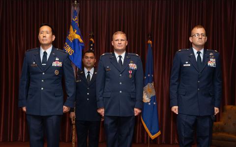 Photo Of From the left, U.S. Air Force Col. Burt Okamoto, 374th Mission Support Group commander; Lt. Col. Mark Wagner, 374th Contracting Squadron outgoing commander; and Lt. Col. Scott Schneider, 374th CONS incoming commander, stand at attention during a change of command ceremony at Yokota Air Base, Japan, July 16, 2024.