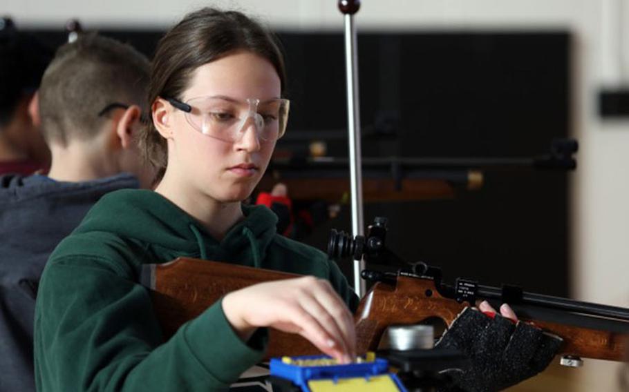 Summer Martinez, a cadet from Edgren High School, reloads a pellet into her rifle during a marksmanship match inside Zama Middle High School's gym at Camp Zama, Japan, Jan. 20, 2023. More than 70 cadets from all eight Department of Defense Education Activity high schools in Japan competed in the invitational event. (Photo Credit: Sean Kimmons)