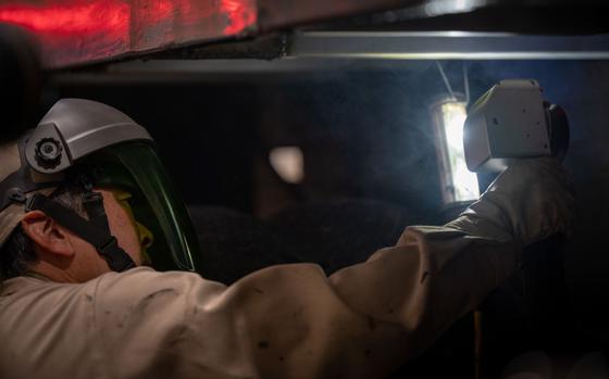 Masato Hasegawa, 35th Logistics Readiness Squadron automobile repairman, maintains government vehicles with an NPL-500 Pulse Machine at Misawa Air Base.