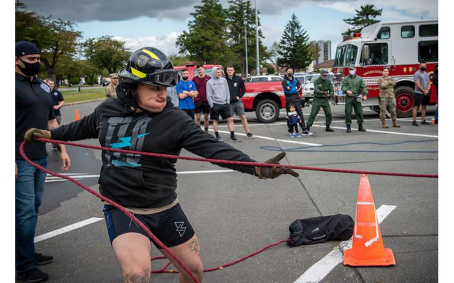 U.S. Air Force Senior Airmen Matthew Melendez, a 35th Civil Engineer Squadron Explosive Ordnance Disposal journeyman, pulls a sled during the 2020 Fire Muster at Misawa Air Base, Japan, Oct. 6, 2020. Fire musters give Airmen from different career fields across the wing an opportunity to test their fitness abilities against one another while experiencing tasks a firefighter would conduct during an emergency. (U.S. Air Force photo by Airman 1st Class China M. Shock)