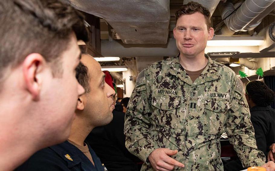 TOKYO BAY (DEC. 11, 2021) Lt. Matthew Moynihan, Chaplain aboard Arleigh Burke-class guided-missile destroyer USS Higgins (DDG 76) greets Sailors during an MWR event. Higgins is assigned to Commander, Task Force (CTF) 71/Destroyer Squadron (DESRON) 15, the Navy's largest forward-deployed DESRON and the U.S. 7th Fleet's principal surface force. (U.S. Navy photo by Mass Communication Specialist 3rd Class Christine Montgomery/released)