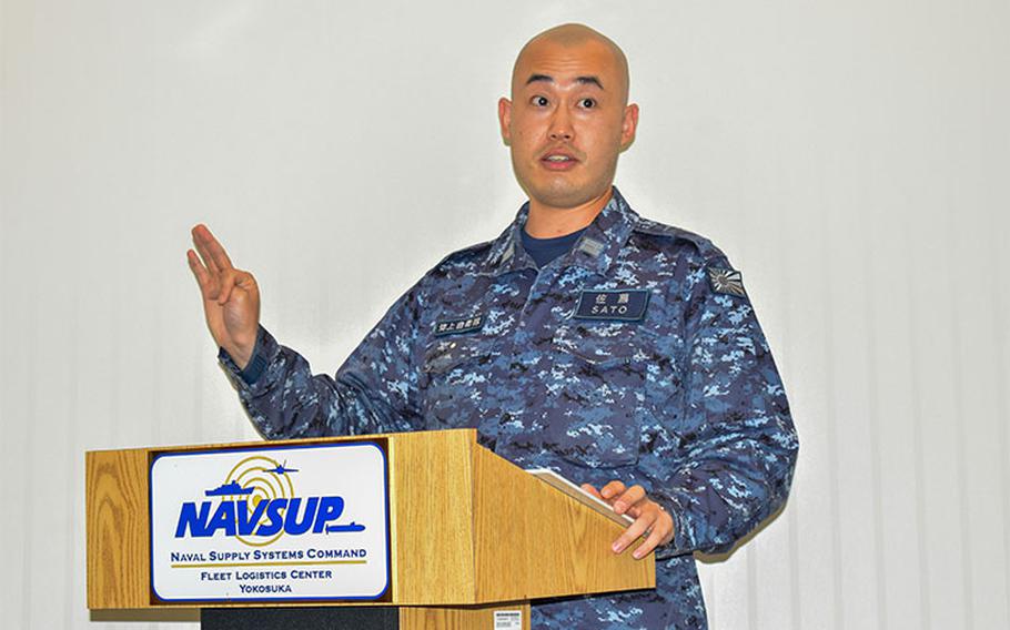 Photo By Brandon Taylor | YOKOSUKA, Japan (Oct. 25, 2021) - Lt. Daigo Sato of the Japan Maritime Self-Defense Force (JMSDF) delivers a speech, introducing himself as the newest intern onboard NAVSUP Fleet Logistics Center (FLC) Yokosuka. Sato, the 105th JMSDF intern at NAVSUP FLC Yokosuka, will become acquainted with the U.S. Navy's supply system and apply his studies to the JMSDF.