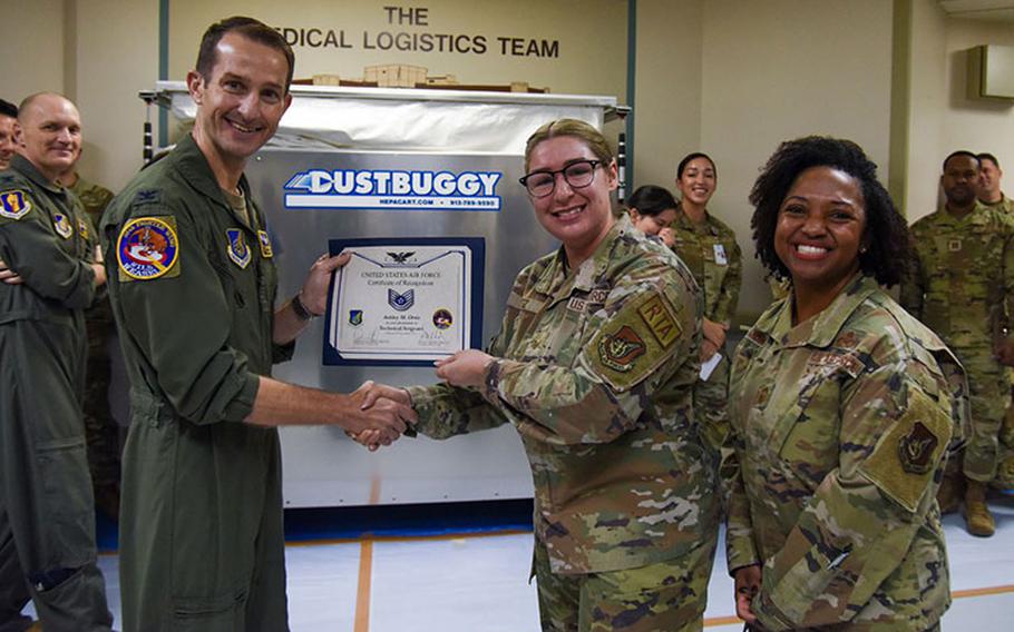 U.S. Air Force Col. Michael Richard, 35th Fighter Wing commander, and Chief Master Sgt. Cheronica Blandburg, 35th FW command chief, present a certificate to Staff Sgt. Ashley Ortiz, 35th Medical Support Squadron pharmacy technician, promoting her to the rank of technical sergeant under the Stripes for Exceptional Performers program at Misawa Air Base, Japan, November 20, 2023. Ortiz was the recipient of the sole stripe the 35th Fighter Wing was authorized to give under the STEP program. (Air Force photo)