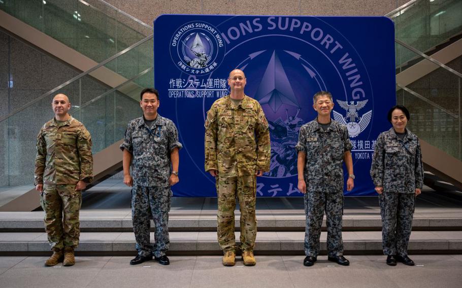 374th AW leadership and JASDF Operational Support Wing leadership pose for a photo during an immersion tour.