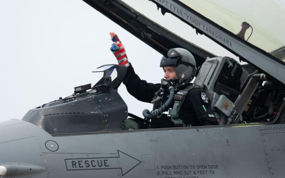 U.S. Air Force Capt. Ethan “Bantam” Smith, Pacific Air Forces F-16 Demonstration Team pilot, signals an engine start in an F-16 Fighting Falcon assigned to the 51st Fighter Wing during a media day as part of Osan Air Power Days 2025.