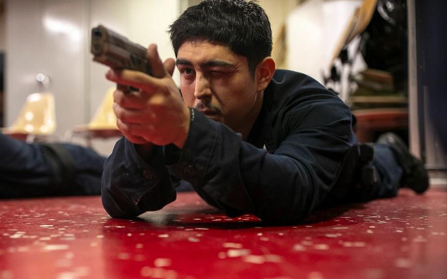 Aviation Boatswain’s Mate (handling) 3rd Class Anthony Slacebo, from Whittier, California, participates in a weapons familiarization training aboard amphibious assault carrier USS Tripoli (LHA 7).