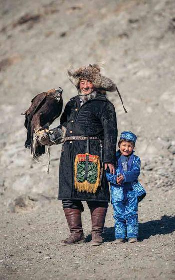 Tenelkhan Bugibay, 74, with grandson.