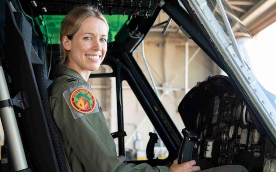 Capt. Jennie Seibert, 459th Airlift Squadron UH-1N Huey pilot and chief of training, sits in a UH-1N at Yokota Air Base, Aug. 4, 2021. Seibert helped translate between the Airmen and Moroccan medical team as well as the local patients during Exercise African Lion 2021. (U.S. Air Force photo by Senior Airman Brieana E. Bolfing)