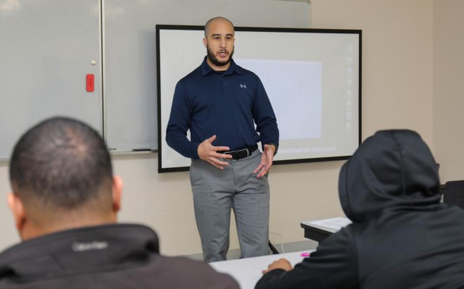 David Schenaker, an Army spouse, teaches a lesson as part of a new male mentorship program for 35th Combat Sustainment Support Battalion personnel inside the Community Recreation Center at Camp Zama, Japan, Feb. 15, 2023. The goal of the “Samurai Diamond” program aims to provide male members of the unit with an opportunity to look within themselves while learning skills that can help lift others. (Photo Credit: Sean Kimmons)