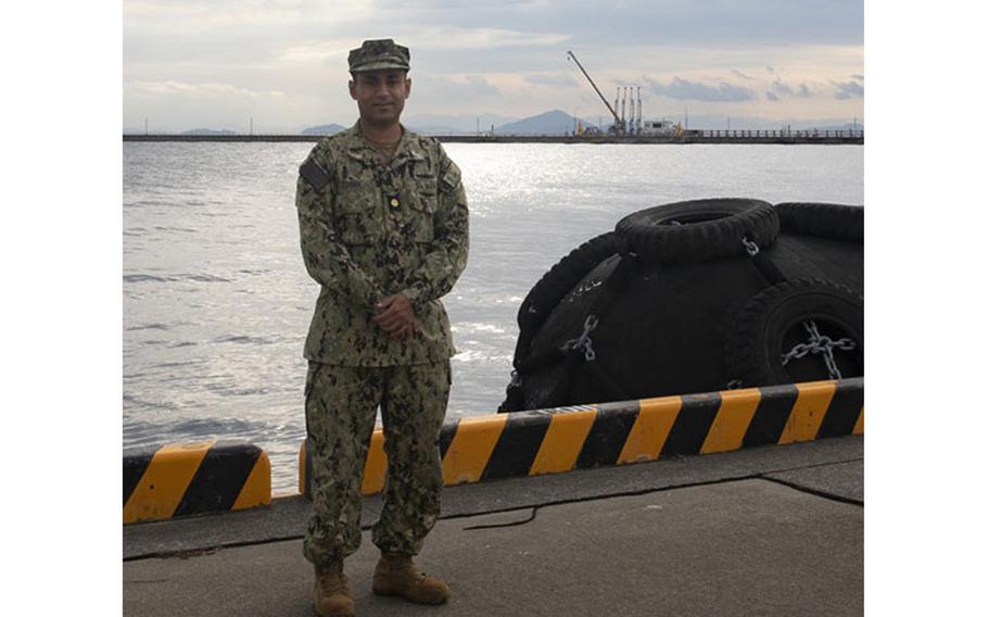 U.S. Navy Lt. Cdr. Ramy Teriak, the Marine Corps Air Station Iwakuni, Japan, logistics officer, poses for a photo at the installation’s harbor Oct. 27, 2022. Teriak’s role as the installation’s logistics officer heavily involves operations at the air station’s harbor, which is uniquely designed to have direct access to a flightline. (U.S. Marine Corps photo by Lance Cpl. Micah Taylor)